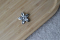 CACHE BOUTON FLEUR