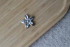 CACHE BOUTON FLEUR